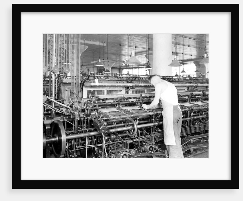 Philadelphia, Pennsylvania - Hosiery. Minnesac Mills. Man working over long row of machines, 1936 by Lewis Hine
