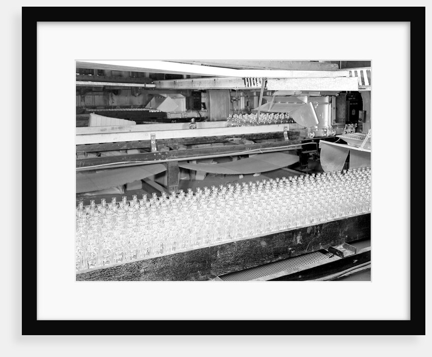 Millville, New Jersey - Glass bottles. Numerous bottles in foreground and bottles on a conveyor belt, 1936 by Lewis Hine