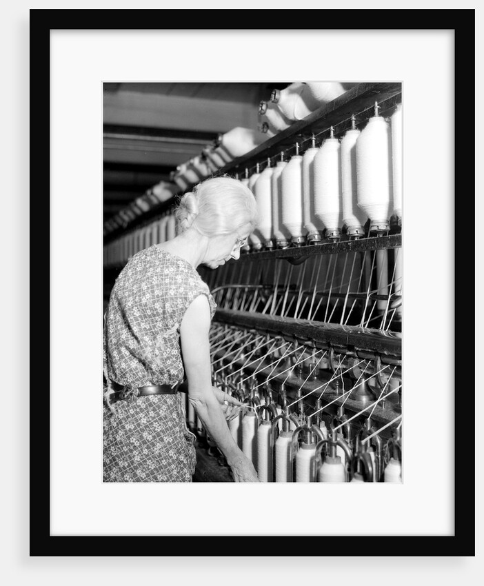Millville, New Jersey - Textiles. Millville Manufacturing Co. Lady twisting thread, 1936 by Lewis Hine