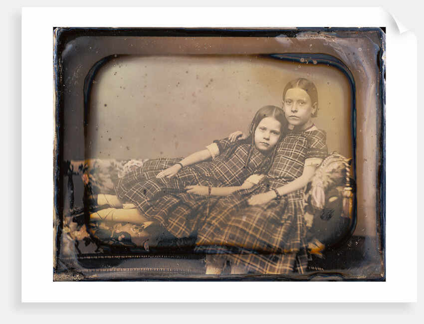 Portrait of two girls reclining on chaise lounge by Sheldon K. Nichols
