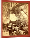 Eiffel Tower Machinery with a Man Beside the Wheel that Raises Elevator by Anonymous