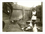 Eckart Titzenthaler, son of the photographer standing on a farm with chickens and geese by Waldemar Titzenthaler