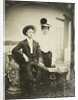 Portrait of a man and a woman, standing and sitting in front of a painted backdrop, deck by G.W. Stevens