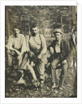 Portrait of three men sitting on a tree stump? In a forest by Anonymous