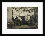 Group portrait of ten women and a man huddled in a carriage in a studio by Anonymous