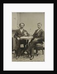 Portrait of two men sitting at the table in a studio, with a bottle and a glass, an imitation salon decor by Anonymous