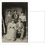 Group portrait of two men and three women, standing and sitting in a cramped studio by Anonymous