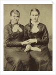 Portrait of two women sitting next to each other and holding each other's hand by Anonymous