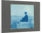 Man in profile, sitting on a rock by the sea, United States, Cyanotype, a photographic printing process that produces a cyan-blue print by Anonymous