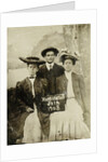 Portrait of a man and two women in front of a painted backdrop (tree, lake and mountains) and a sign that read 'Huntington FAIR 1905 by Anonymous