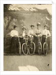 Group portrait of five women with bikes for a painted backdrop with forest by Anonymous