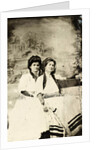 Portrait of two women sitting on a bench in front of a painted backdrop (chapel or church (?) In a lake), in the left part of the American flag by Anonymous