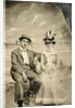 Portrait of a man and woman sitting in front of a painted backdrop (beach, sea and pier) by Anonymous