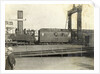 Locomotive and train at a railway yard by Anonymous