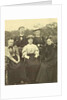 Group portrait of four women and one man around a table in the open air by Anonymous