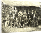 Group portrait of hikers in a makeshift studio by Anonymous