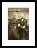 Portrait of an elderly man and woman sitting on a wooden wall or fence by Anonymous