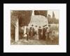 Group portrait of five women (one of whom is behind a camera) and two men for a ruin in Italy or France by Anonymous
