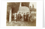 Group portrait of five women (one of whom is behind a camera) and two men for a ruin in Italy or France by Anonymous