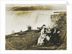 Group portrait of a man, woman and boy with Niagara Falls in the background by Edward Davis