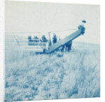 Farmers in a combine harvester, waiting laadkar by Anonymous