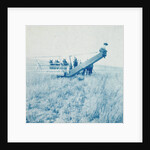 Farmers in a combine harvester, waiting laadkar by Anonymous