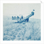 Farmers in a combine harvester, waiting laadkar by Anonymous