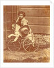 Louis Asser, son of the photographer, on a tricycle by Eduard Isaac Asser