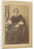 Portrait of a seated woman in a dress with a book in hand by London and Continental Photographic Copying Company