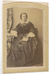 Portrait of a seated woman in a dress with a book in hand by London and Continental Photographic Copying Company