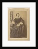Portrait of a seated woman in a dress with a book in hand by London and Continental Photographic Copying Company