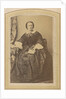 Portrait of a seated woman in a dress with a book in hand by London and Continental Photographic Copying Company