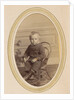 Portrait of a child on a chair with lace-up boots and a packet by J.C. Reesinck
