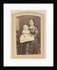 Portrait of a woman in a plaid dress with a baby on lap by E. Steffen