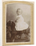 Portrait of a toddler in a dress on a rocking horse by C.J.L. Vermeulen