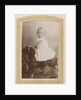Portrait of a toddler in a dress on a rocking horse by C.J.L. Vermeulen