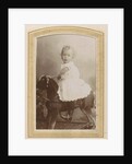 Portrait of a toddler in a dress on a rocking horse by C.J.L. Vermeulen
