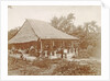 Man and woman posing for a house with a garden in Ambon, Indonesia by Anonymous
