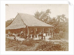 Man and woman posing for a house with a garden in Ambon, Indonesia by Anonymous
