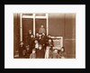 Group of children posing on stairs for entrance doors by Anonymous