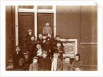 Group of children posing on stairs for entrance doors by Anonymous
