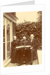 Two men and a woman sitting at home with a book on the table by Anonymous