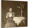 Female working at a table with tablecloth and flowers by Anonymous