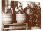 Brouwer and attendants cleaning bottles at a bottle drying rack by Anonymous