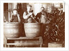 Brouwer and attendants cleaning bottles at a bottle drying rack by Anonymous