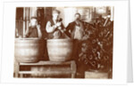 Brouwer and attendants cleaning bottles at a bottle drying rack by Anonymous