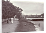 Hikers on a riverbank in Surabaya and in the background the Goebengbrug, Indonesia by Anonymous