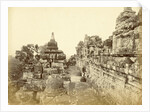 Indian man on a relationship of Borobudur in Java, Indonesia by Anonymous