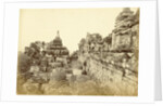 Indian man on a relationship of Borobudur in Java, Indonesia by Anonymous