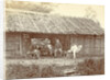 Dutch soldiers sitting in front of a wooden house in the Dutch East Indies by Anonymous